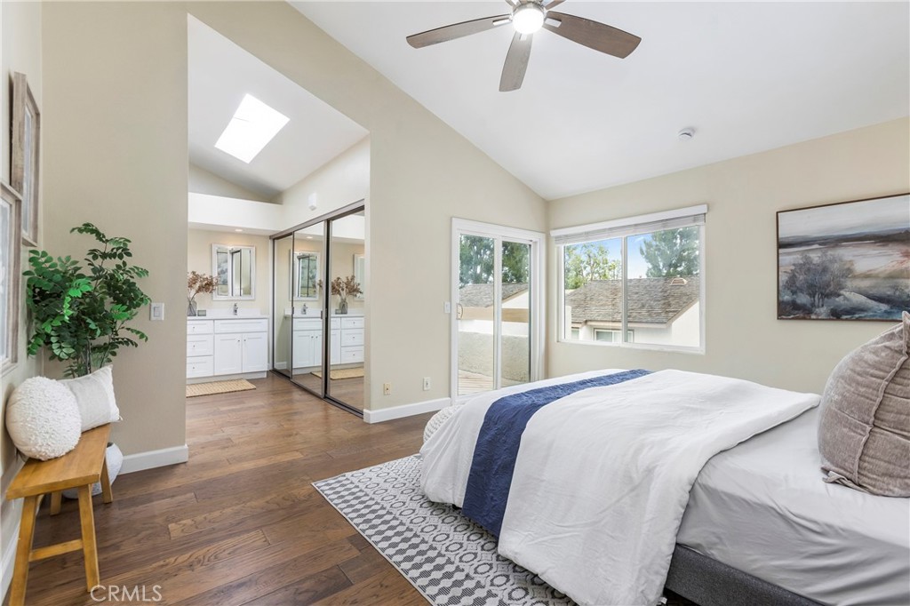 249 Mountain Court Brea, CA 92821 - Photo 15 of 37 a bedroom with a large bed and a chandelier
