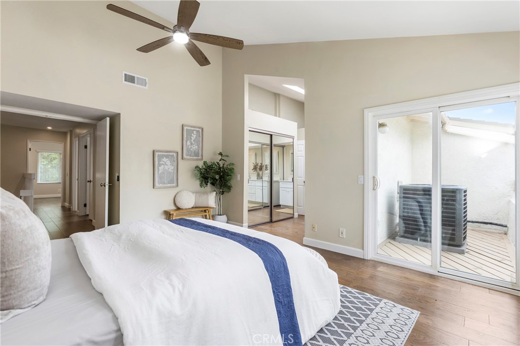 249 Mountain Court Brea, CA 92821 - Photo 17 of 37 a bedroom with a large bed and a chandelier