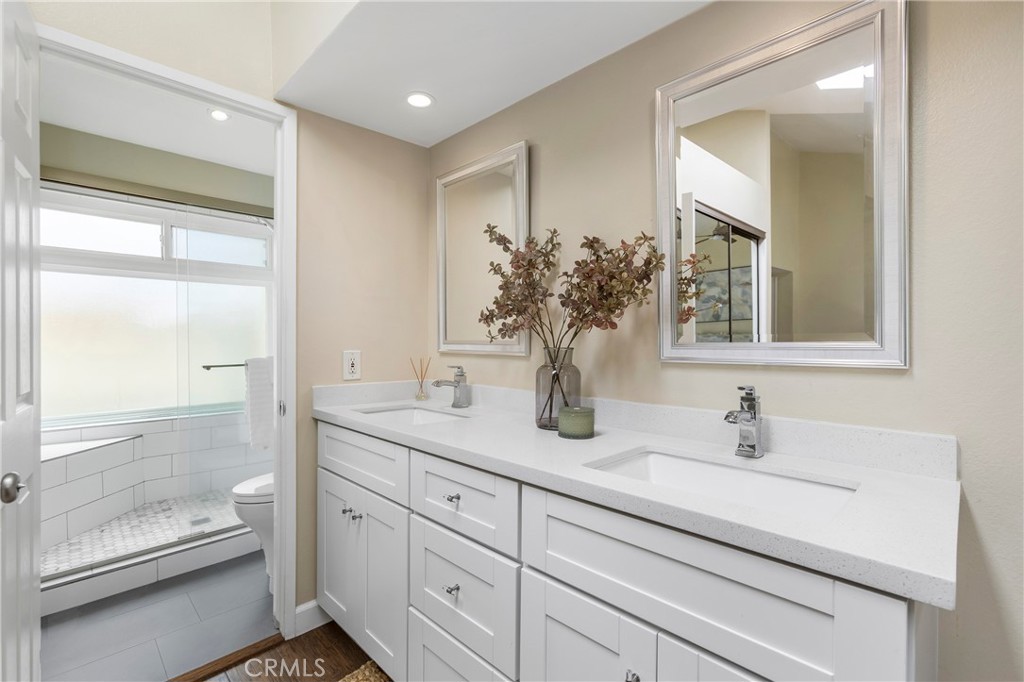 249 Mountain Court Brea, CA 92821 - Photo 19 of 37 a bathroom with a sink and a mirror