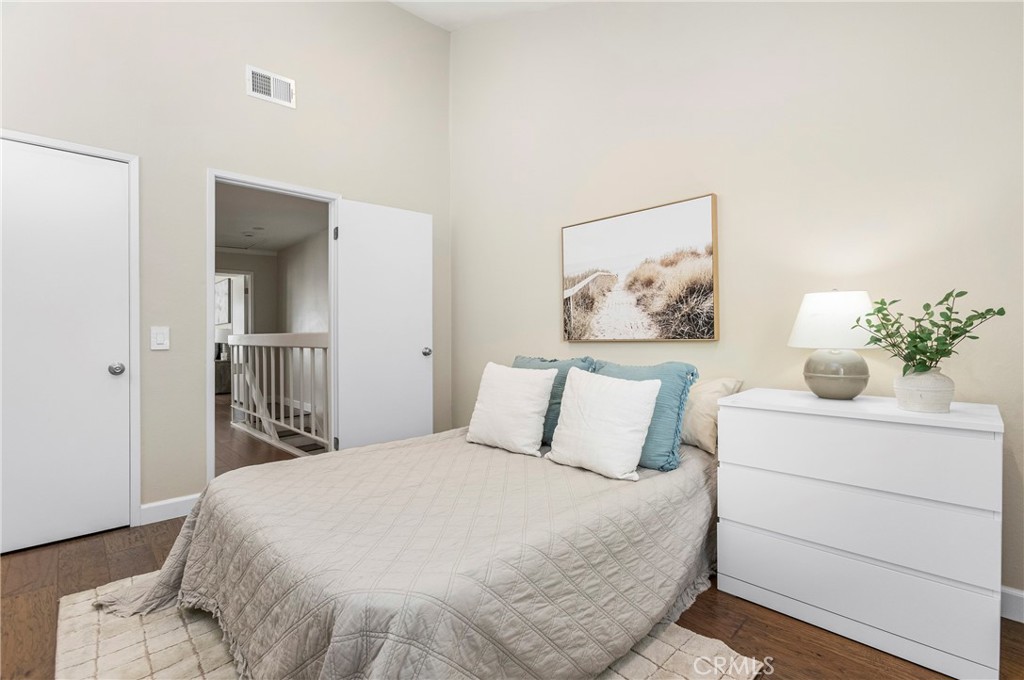 249 Mountain Court Brea, CA 92821 - Photo 20 of 37 a bedroom with a bed and a painting on the wall