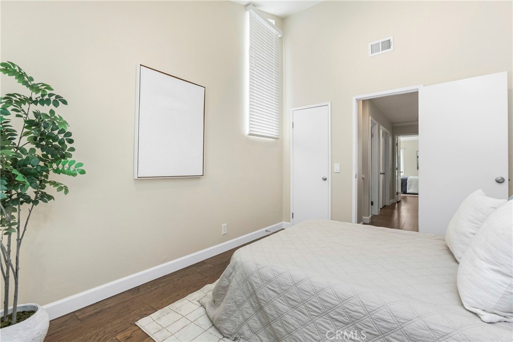 249 Mountain Court Brea, CA 92821 - Photo 22 of 37 a bedroom with a bed and a potted plant