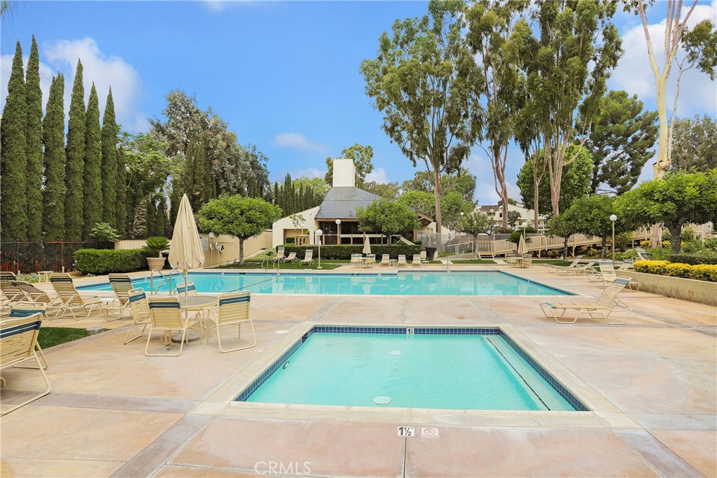 249 Mountain Court Brea, CA 92821 - Photo 31 of 37 a view of swimming pool with outdoor seating and trees in the background