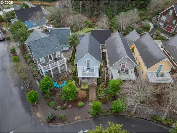 an aerial view of a house with a yard and potted plants