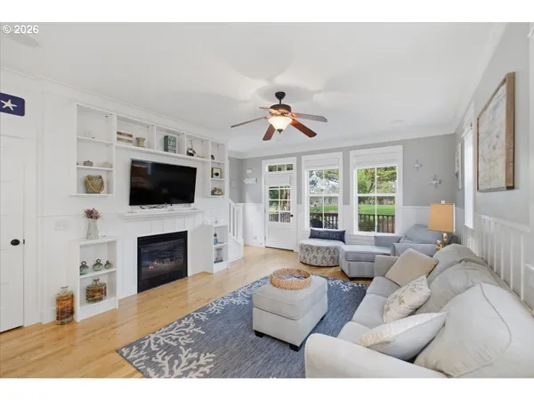 a living room with furniture fireplace and flat screen tv
