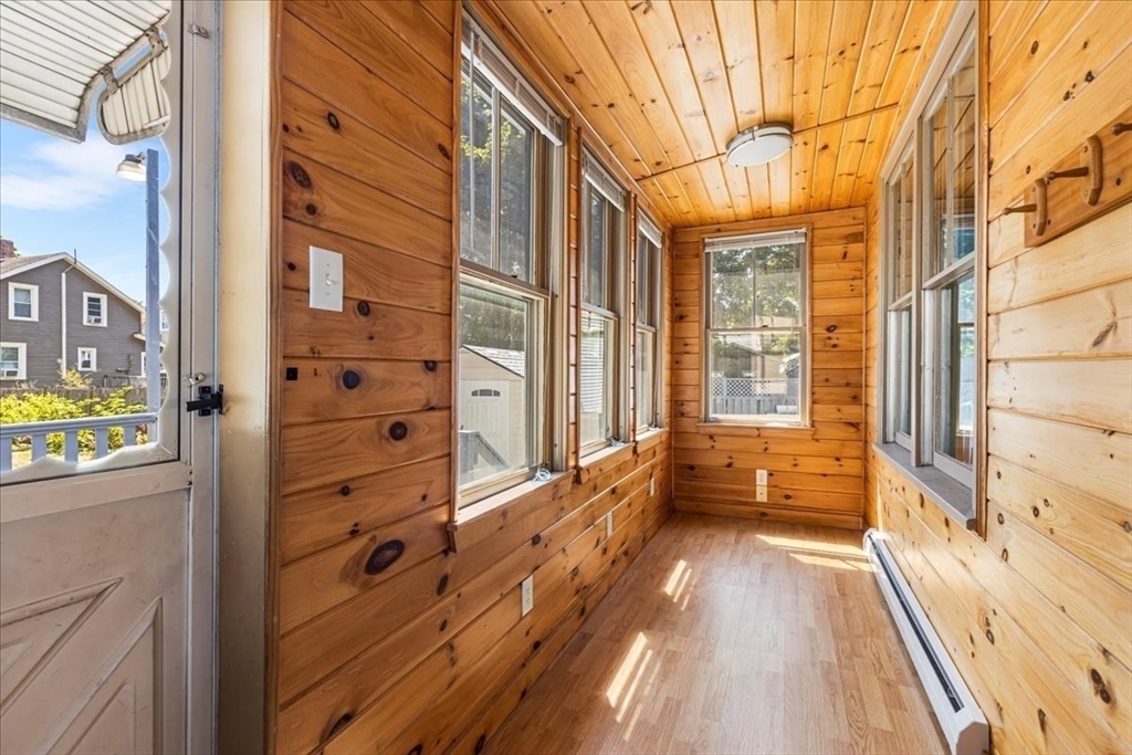 313 Main Street Fairhaven, MA 02719 - Photo 19 of 42 a view of a balcony with wooden floor and brick walls