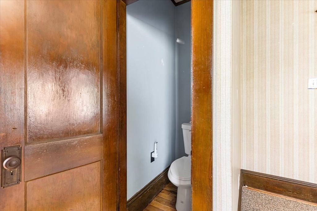 313 Main Street Fairhaven, MA 02719 - Photo 26 of 42 a bathroom with a granite countertop shower and a toilet