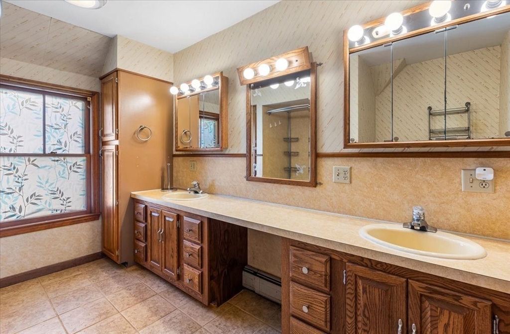 313 Main Street Fairhaven, MA 02719 - Photo 28 of 42 a spacious bathroom with a tub sink and mirror