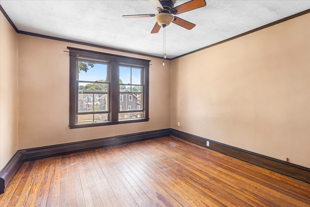 313 Main Street Fairhaven, MA 02719 - Photo 30 of 42 a view of an empty room with wooden floor and a window