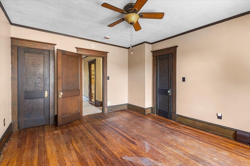 313 Main Street Fairhaven, MA 02719 - Photo 31 of 42 a view of hallway with wooden floor and a ceiling fan