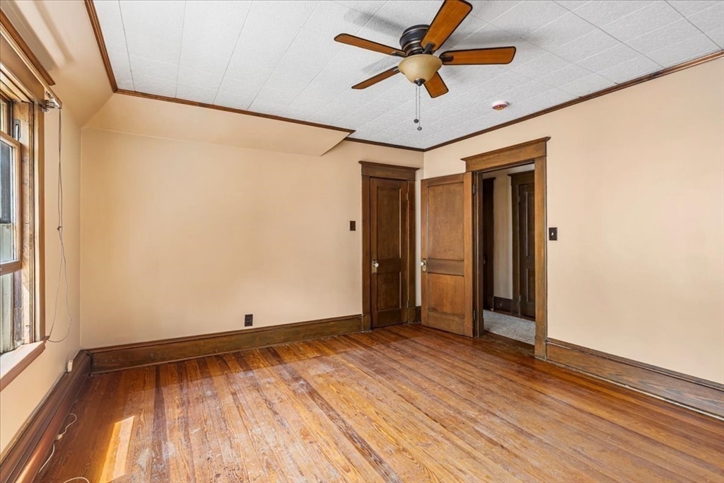 313 Main Street Fairhaven, MA 02719 - Photo 33 of 42 a view of room with hardwood floor and a ceiling fan