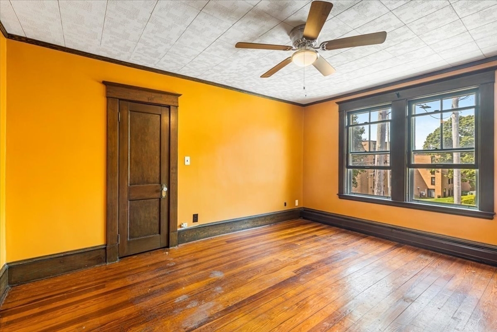 313 Main Street Fairhaven, MA 02719 - Photo 34 of 42 a view of empty room with wooden floor and fan