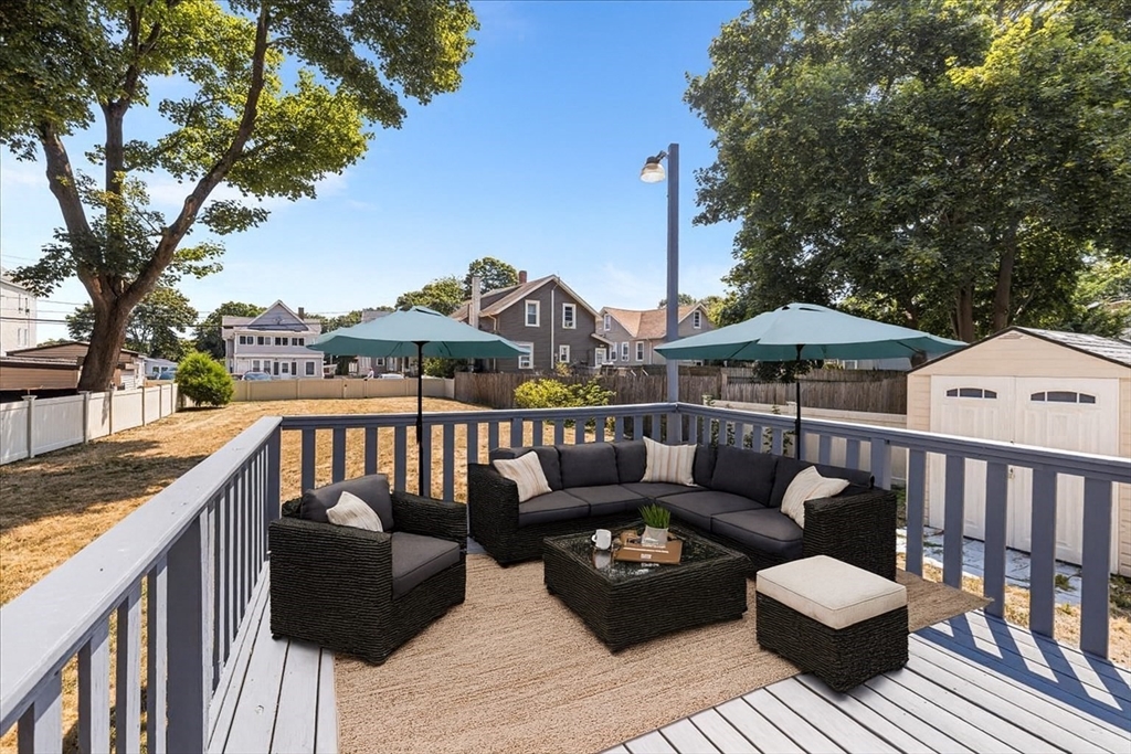 313 Main Street Fairhaven, MA 02719 - Photo 4 of 42 a view of a roof deck with furniture