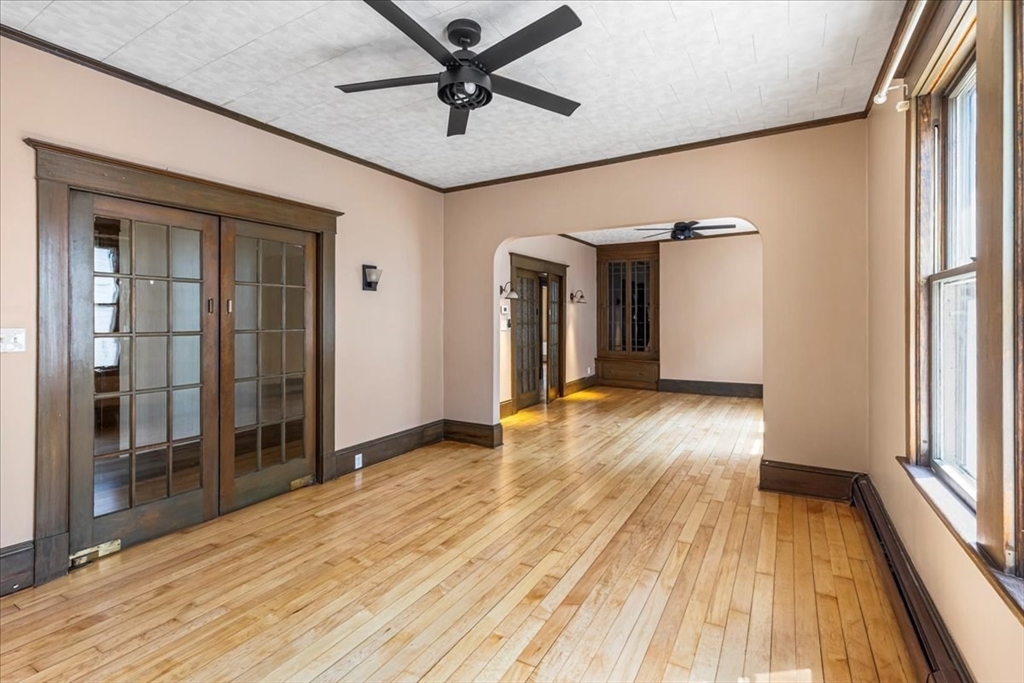 313 Main Street Fairhaven, MA 02719 - Photo 10 of 42 wooden floor in an empty room with a window