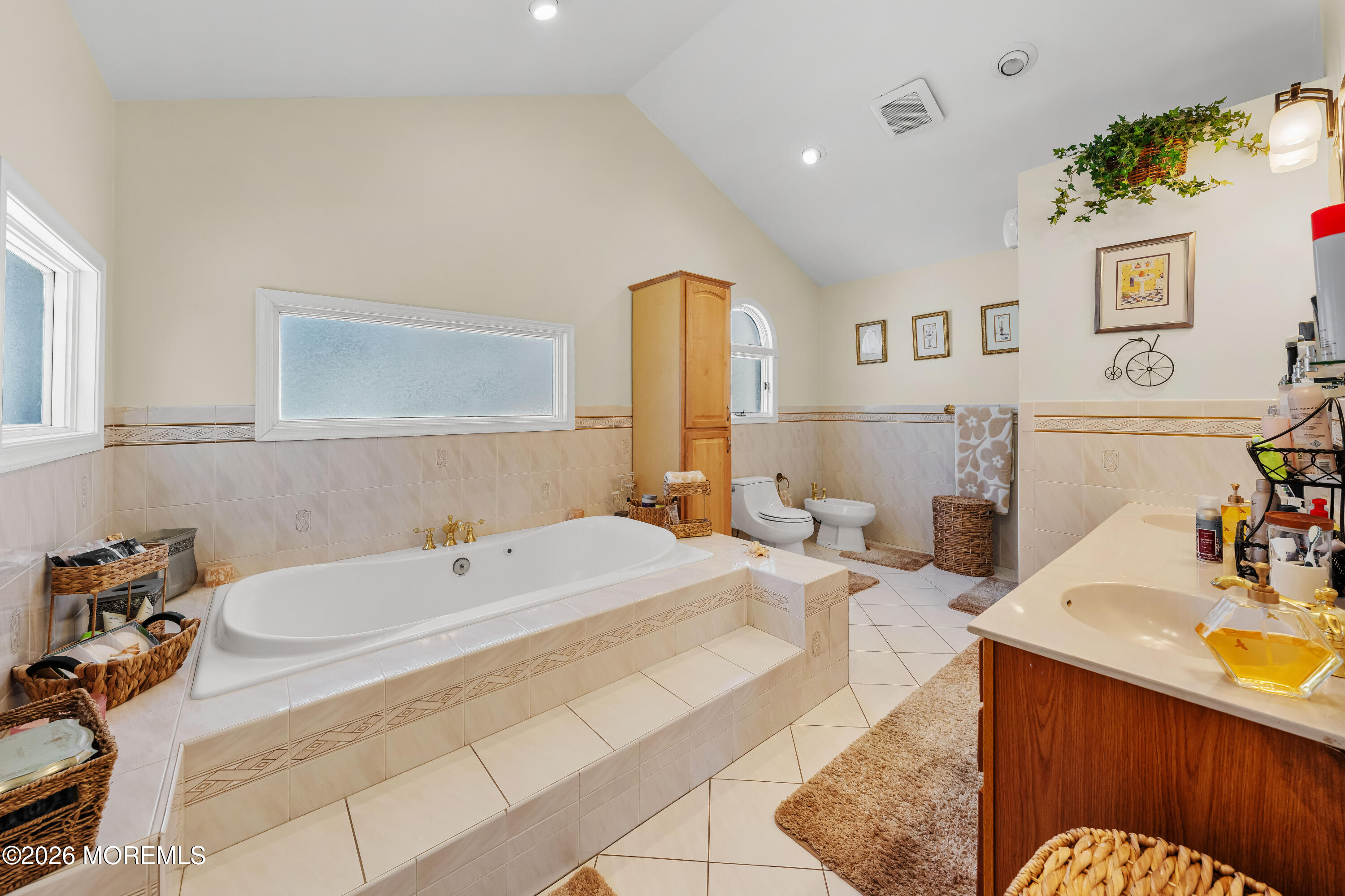 34 Brookside Avenue Old Bridge, NJ 08857 - Photo 30 of 71 a bathroom with a tub sink and mirror