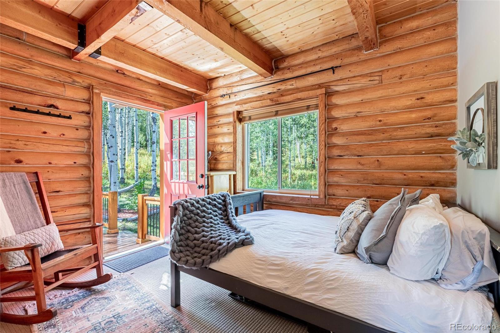 58165 Jupiter Place Clark, CO 80428 - Photo 13 of 34 a bedroom with a bed and a chair