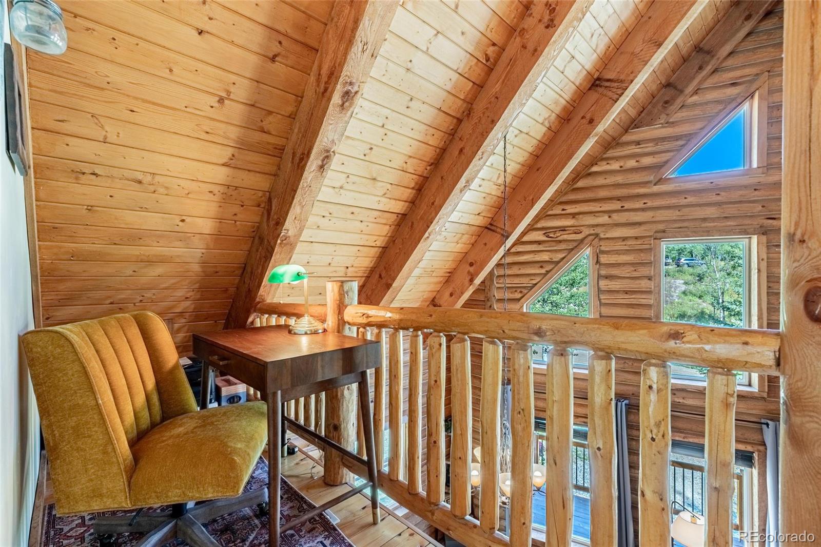 58165 Jupiter Place Clark, CO 80428 - Photo 16 of 34 a balcony with table and chairs