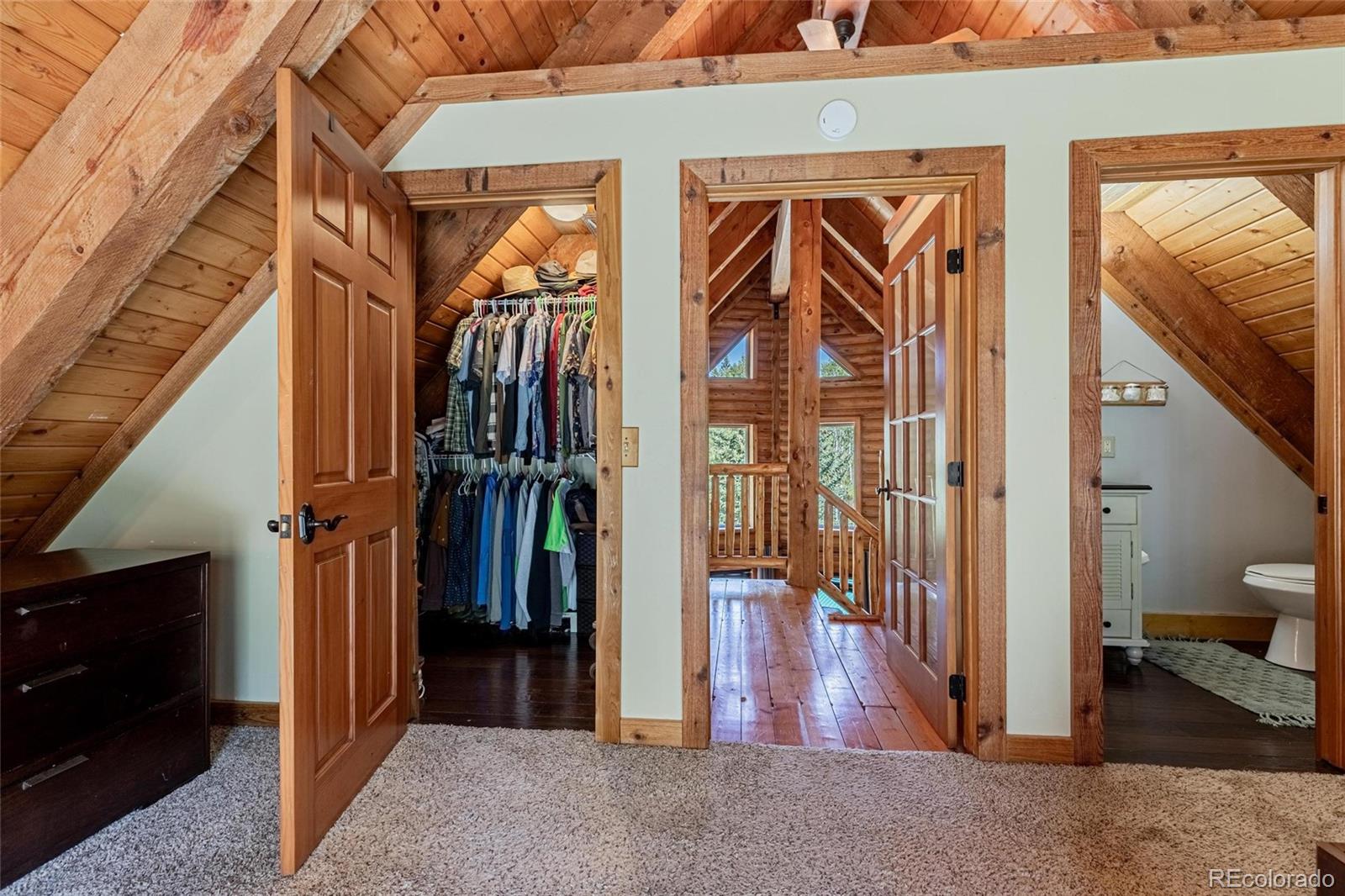 58165 Jupiter Place Clark, CO 80428 - Photo 19 of 34 a view of hallway with wooden floor and stairs
