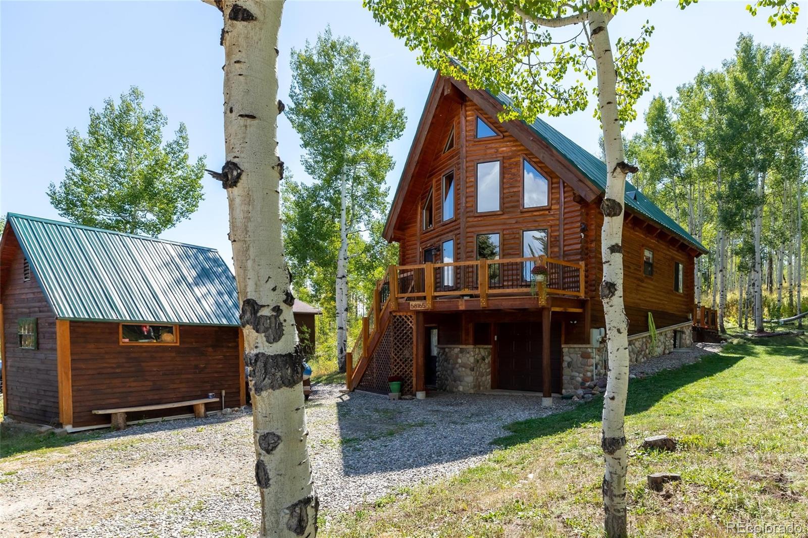 58165 Jupiter Place Clark, CO 80428 - Photo 32 of 34 a front view of a house with garden