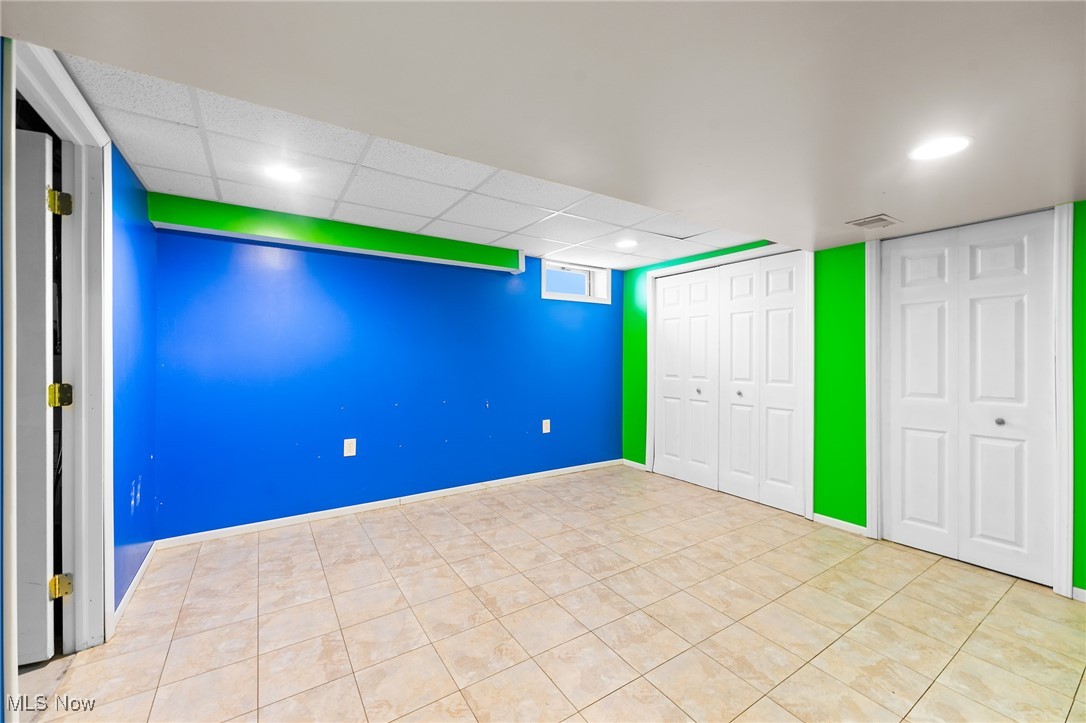 6272 Merwin Chase Road Brookfield, OH 44403 - Photo 28 of 38 Basement with a drop ceiling and light tile patterned floors