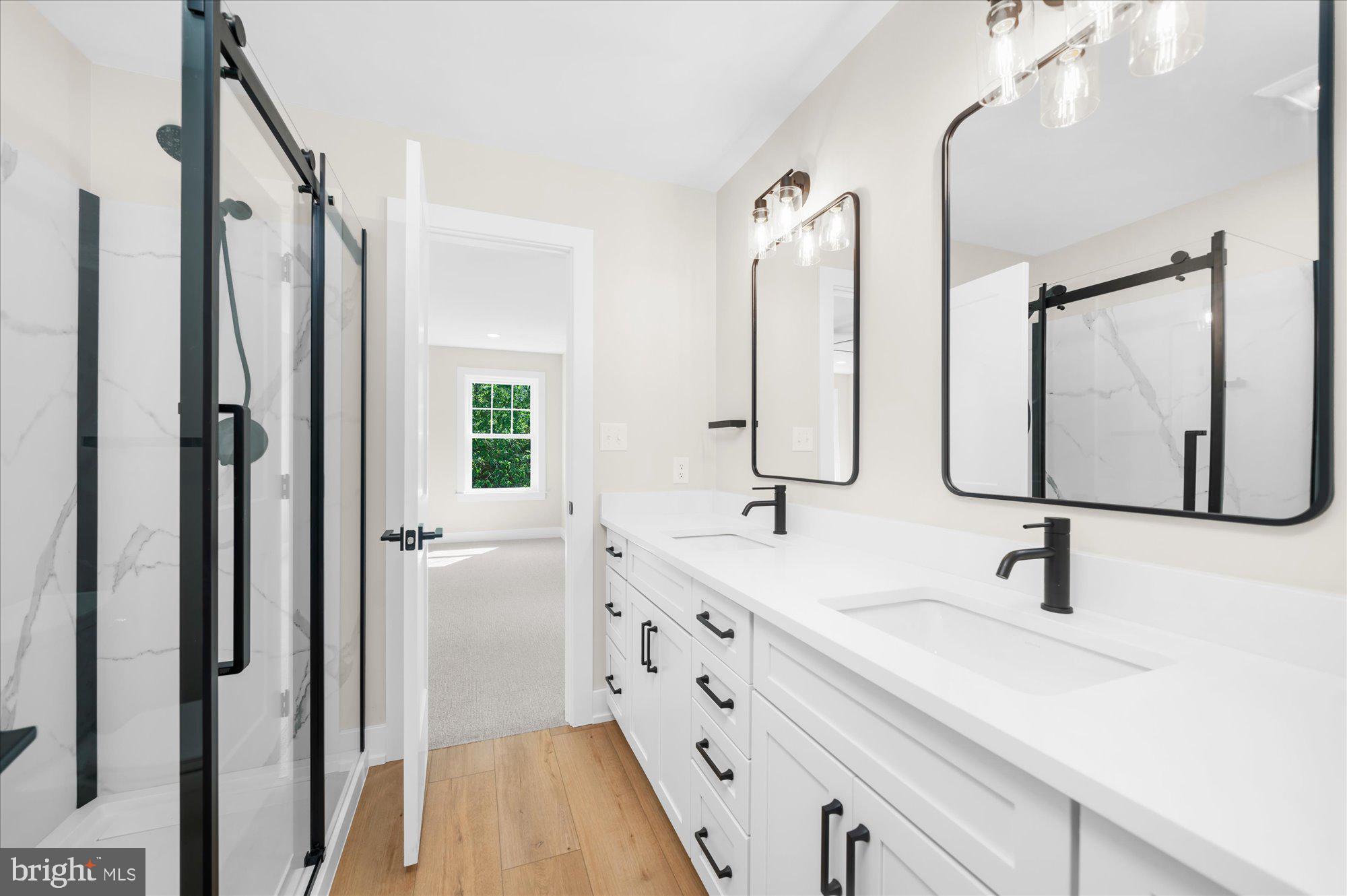 394 Renninger Road Perkiomenville, PA 18074 - Photo 34 of 41 a bathroom with double vanity sink a mirror a glass door a shower and vanity