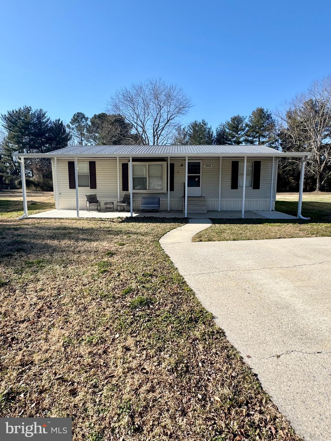 9333 Colonial Mill Drive Delmar, MD 21875 - Photo 1 of 31 a front view of a house with a yard