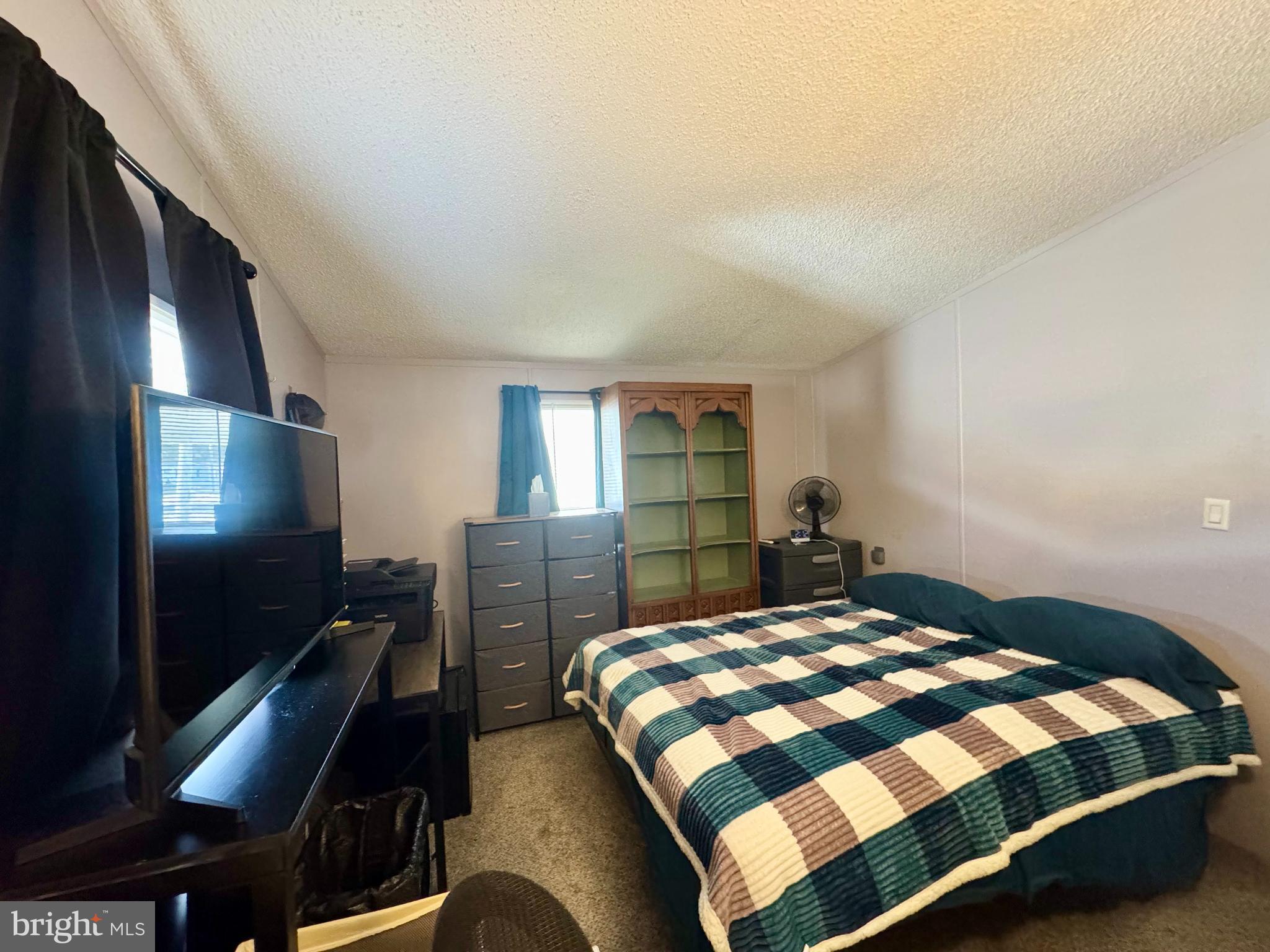 9333 Colonial Mill Drive Delmar, MD 21875 - Photo 13 of 31 a bedroom with a bed and a flat screen tv