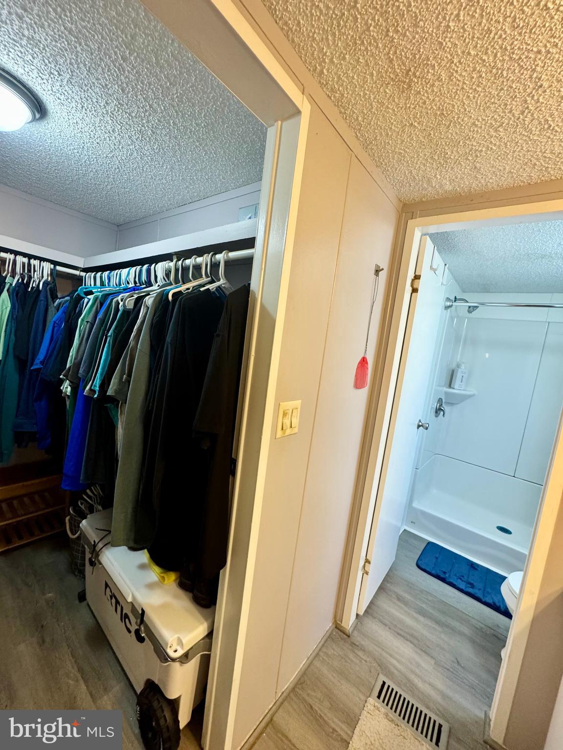 9333 Colonial Mill Drive Delmar, MD 21875 - Photo 15 of 31 a view of walk in closet with clothes and shoes