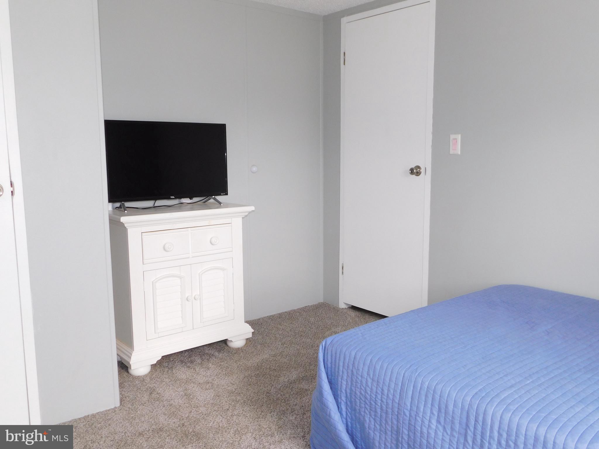 9333 Colonial Mill Drive Delmar, MD 21875 - Photo 20 of 31 a bedroom with a bed and a flat screen tv