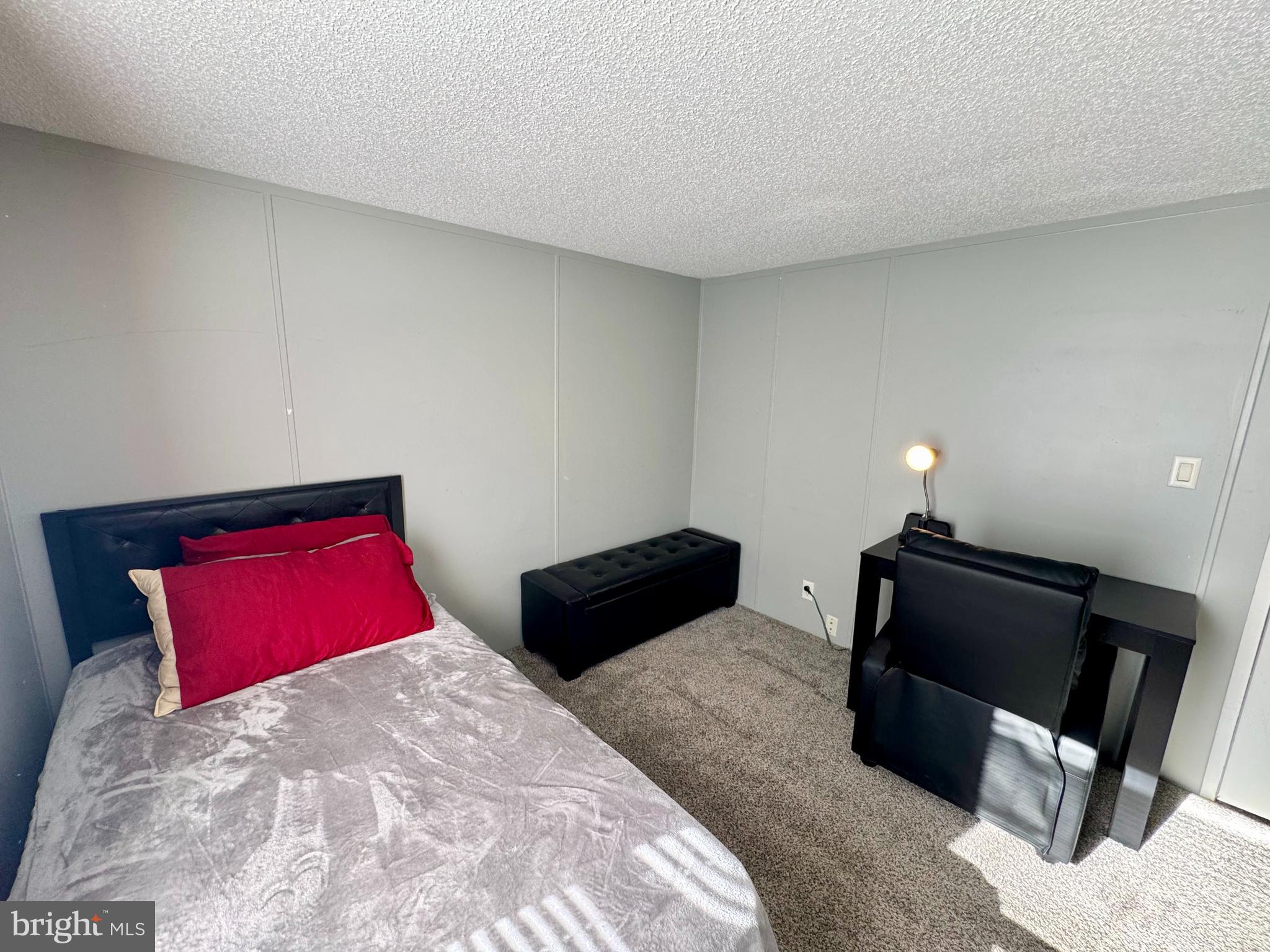 9333 Colonial Mill Drive Delmar, MD 21875 - Photo 23 of 31 a bedroom with a bed and a chair