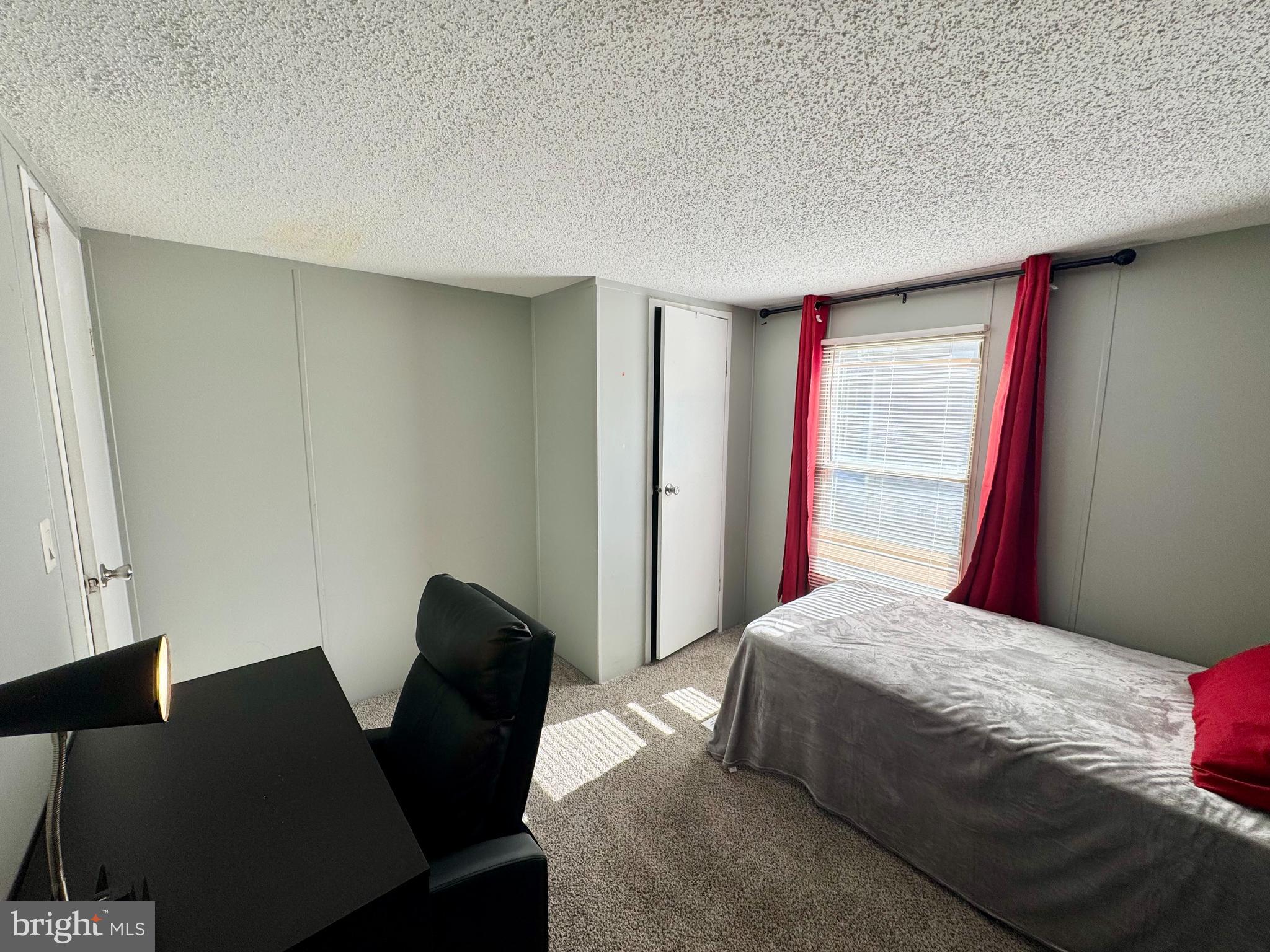 9333 Colonial Mill Drive Delmar, MD 21875 - Photo 24 of 31 a bedroom with a bed and a chair