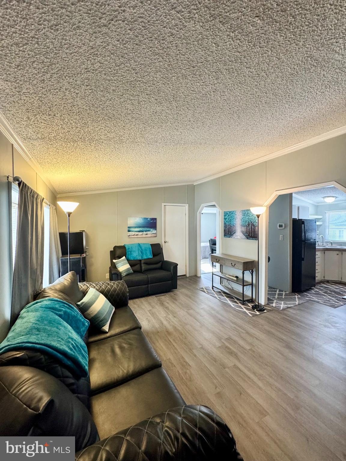 9333 Colonial Mill Drive Delmar, MD 21875 - Photo 3 of 31 a living room with furniture and a wooden floor