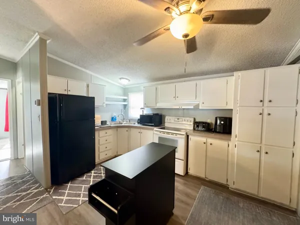 a kitchen with a refrigerator a sink and dishwasher