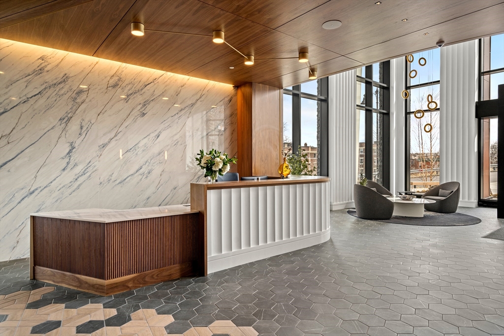 1515 Commonwealth Avenue, Unit 806 Boston, MA 02135 - Photo 13 of 21 a view of a porch with furniture