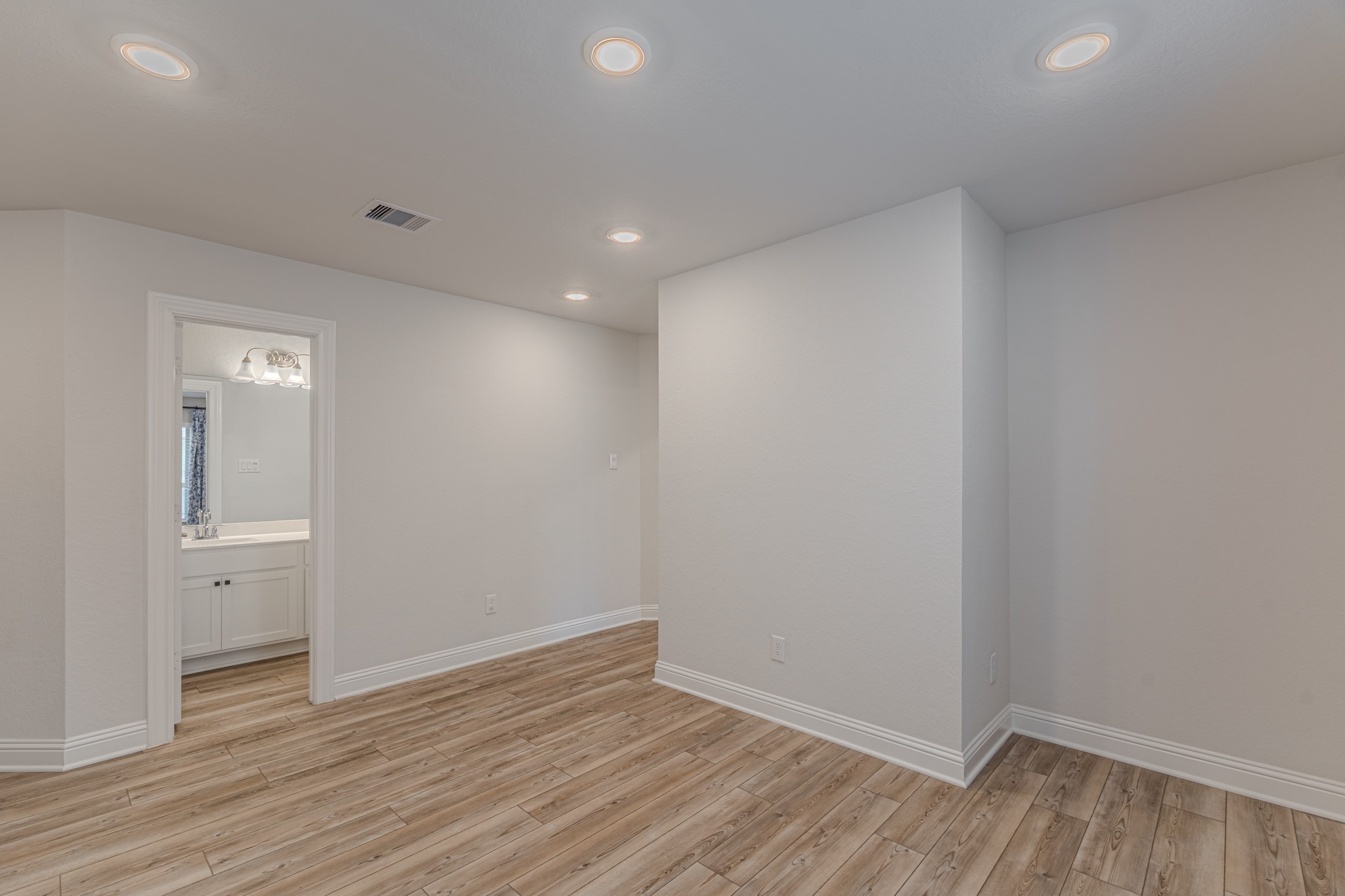 9840 Sweet Flag Court Conroe, TX 77385 - Photo 32 of 50 Spacious game room offers versatility to fit your lifestyle—ideal for movie nights, gaming, or a secondary family gathering area.