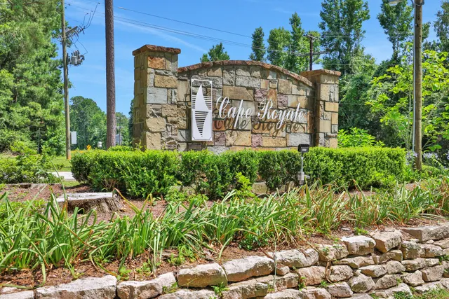 a view of a brick building next to a yard
