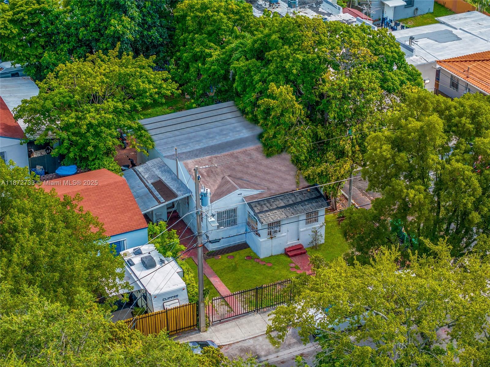 591 Northwest 34th Street Miami, FL 33127 - Photo 8 of 14 an aerial view of a house with garden space and street view