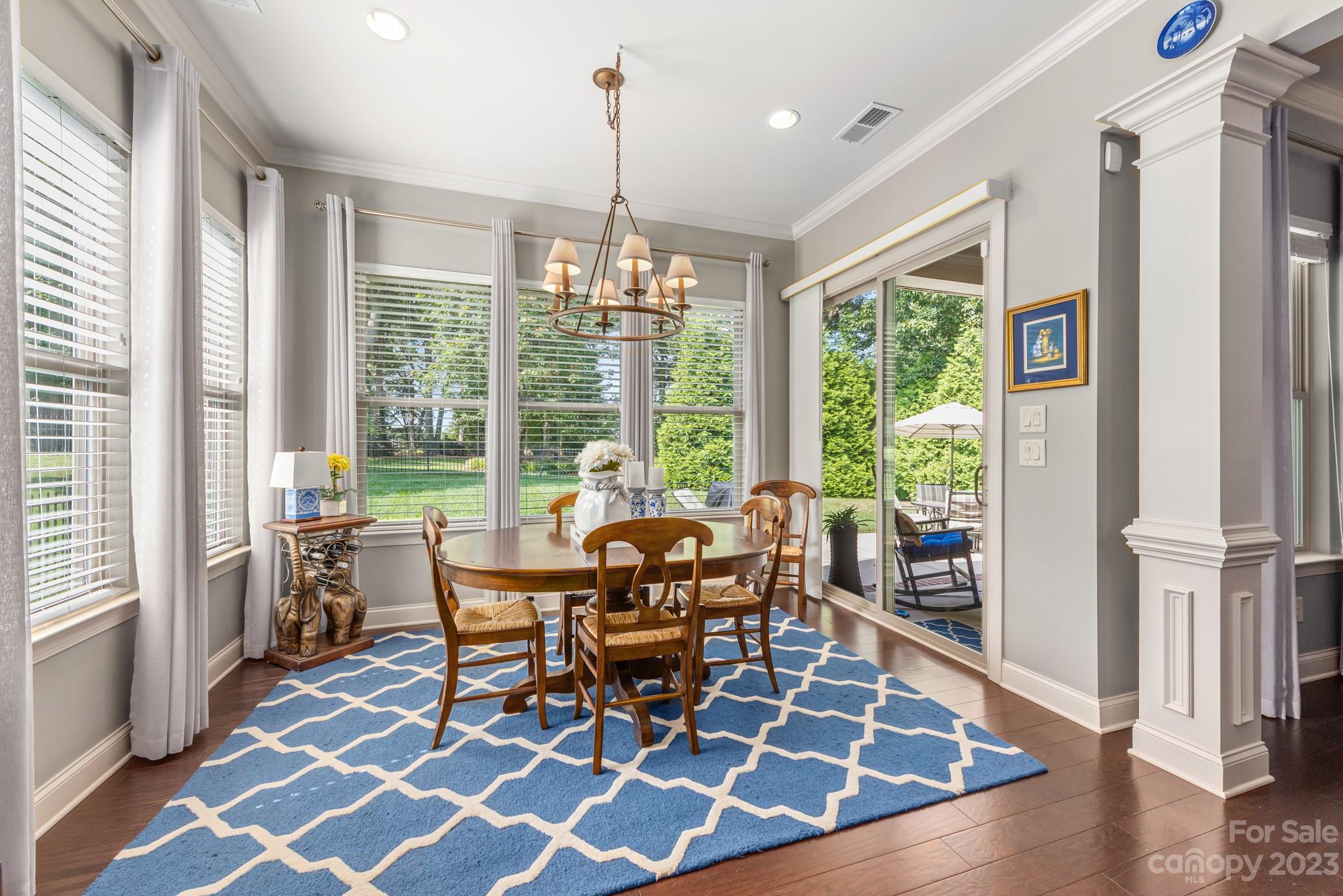 9006 Blue Ridge Drive Indian Land, SC 29707 - Photo 14 of 27 a dining room with furniture and wooden floor