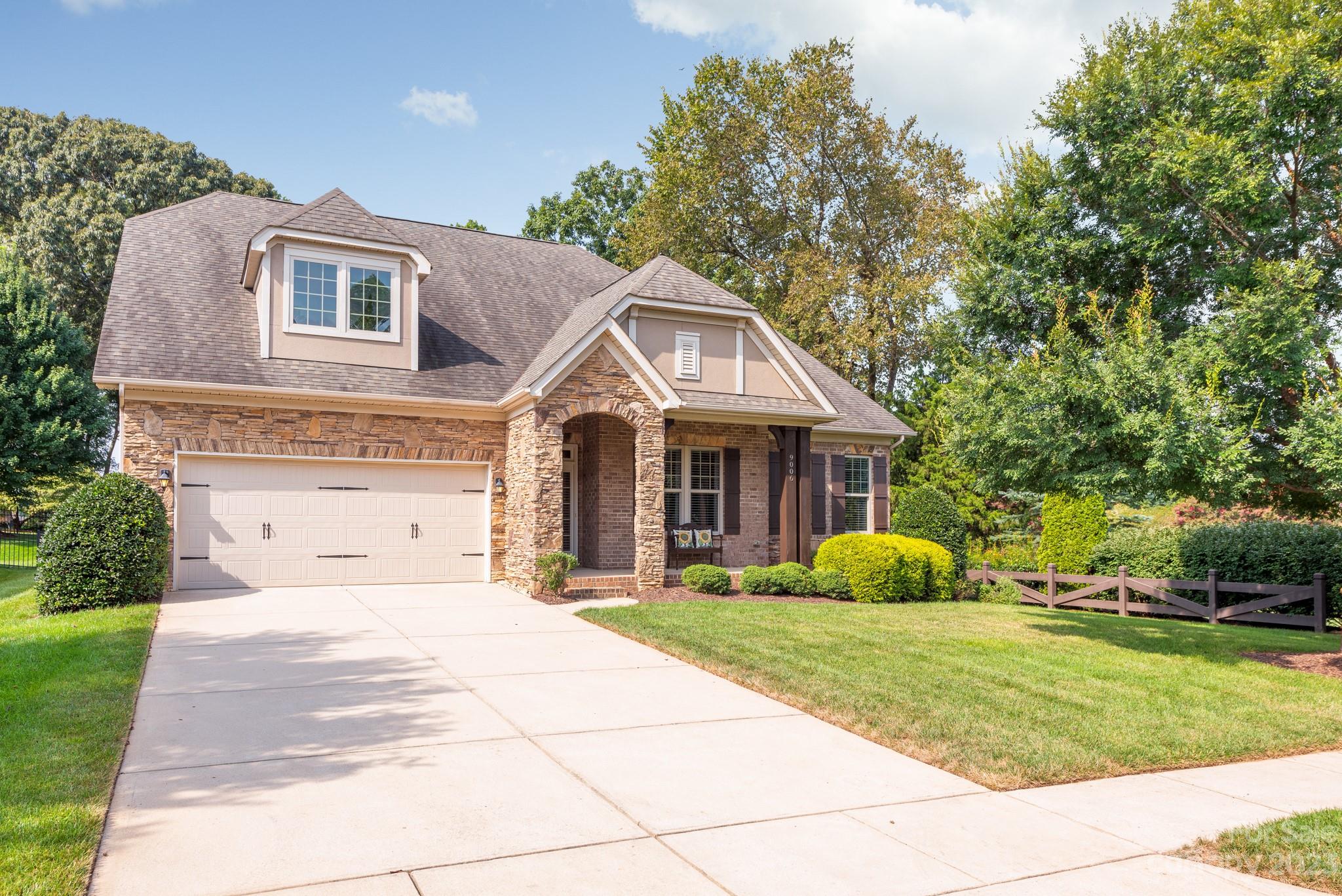 9006 Blue Ridge Drive Indian Land, SC 29707 - Photo 2 of 27 a front view of house with yard and green space
