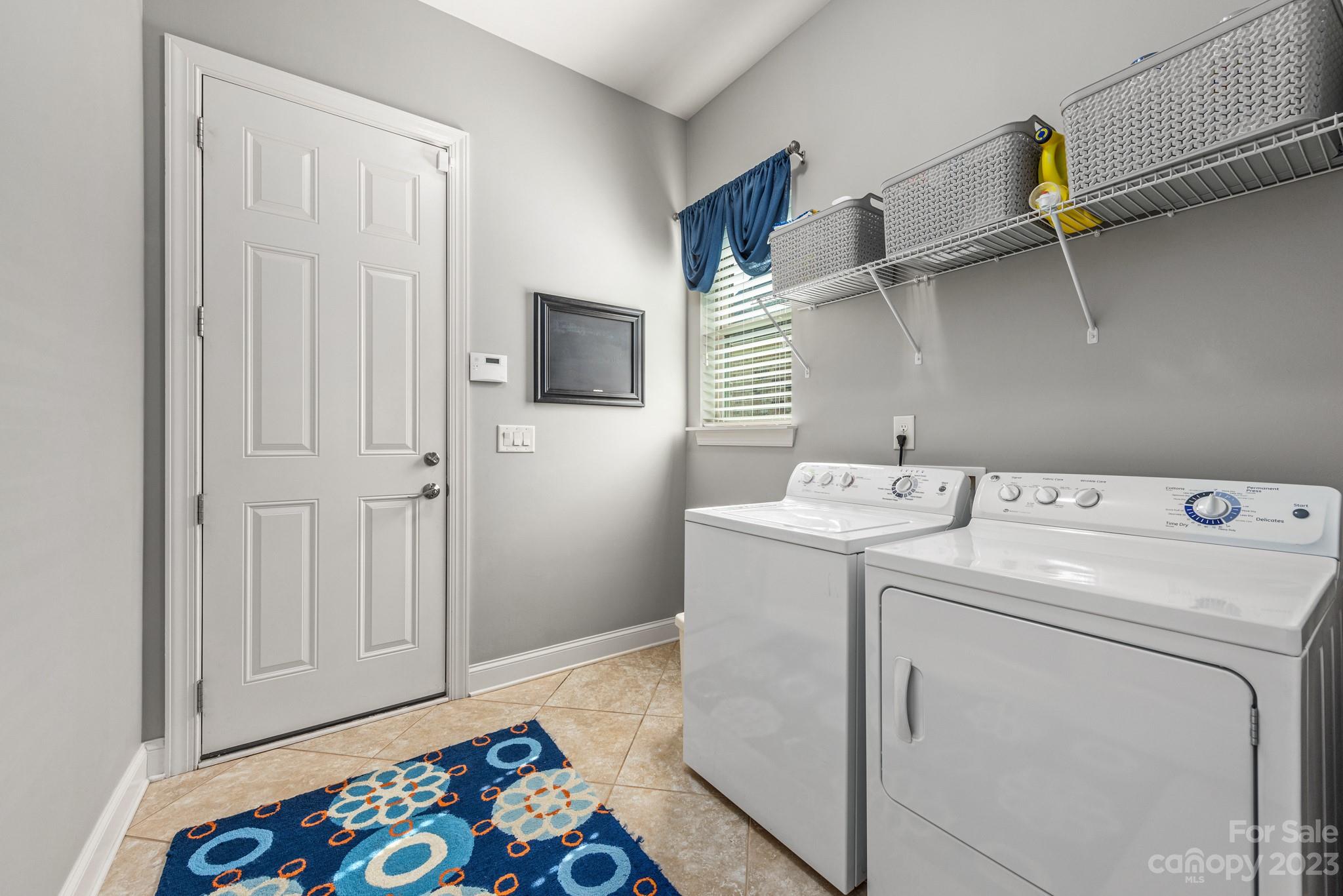 9006 Blue Ridge Drive Indian Land, SC 29707 - Photo 21 of 27 a utility room with dryer and washer