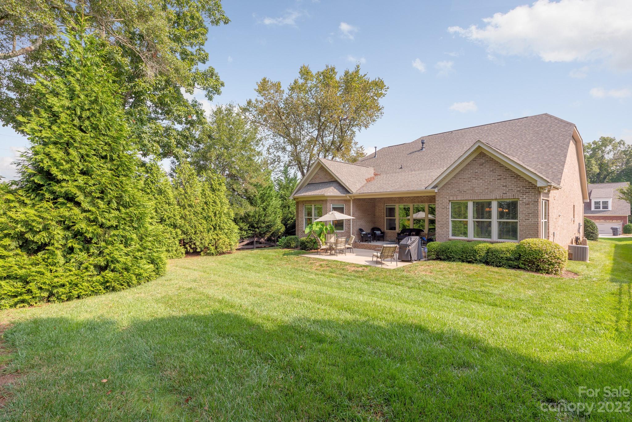 9006 Blue Ridge Drive Indian Land, SC 29707 - Photo 24 of 27 a view of house with garden and trees
