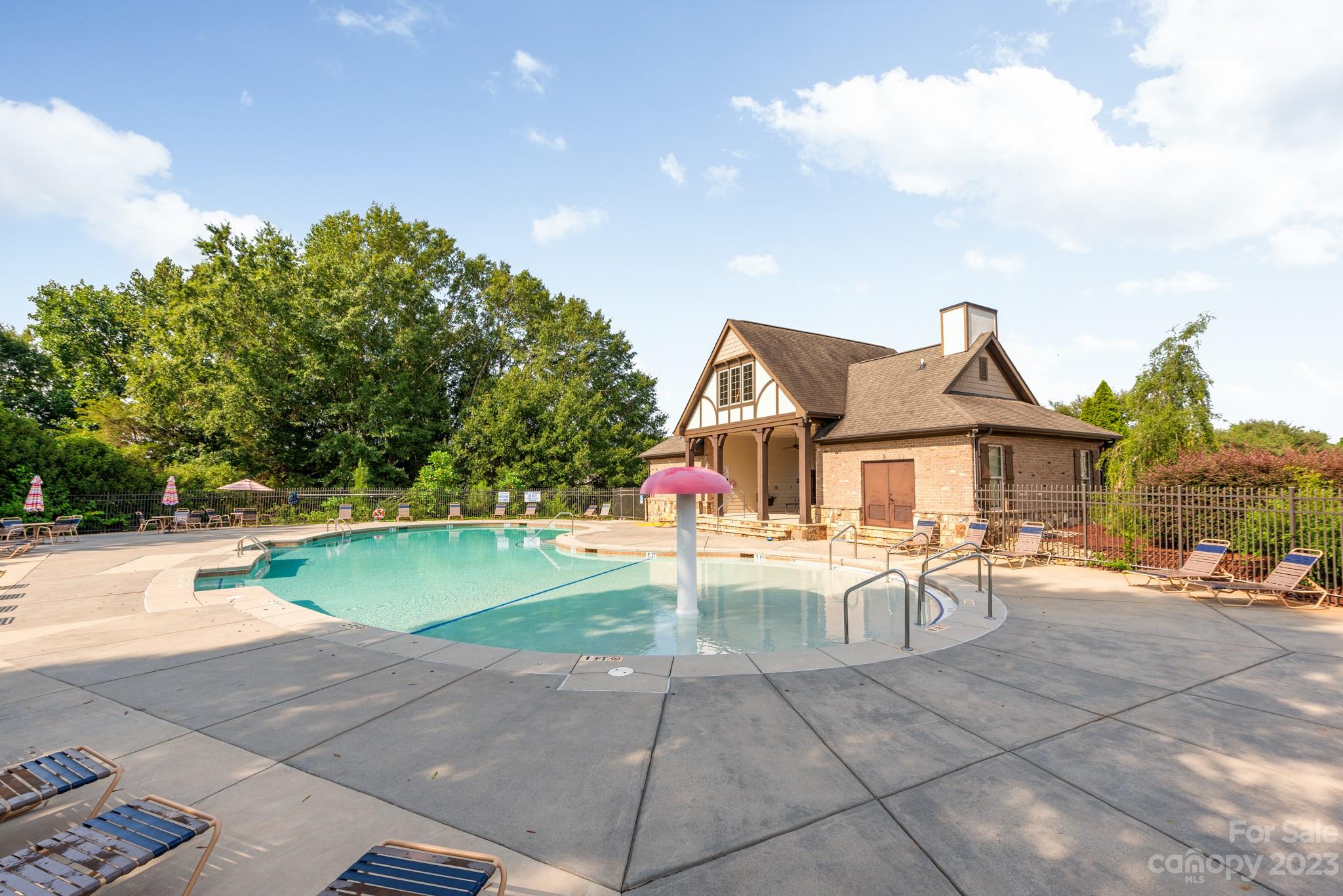 9006 Blue Ridge Drive Indian Land, SC 29707 - Photo 26 of 27 a view of a house with swimming pool and sitting area