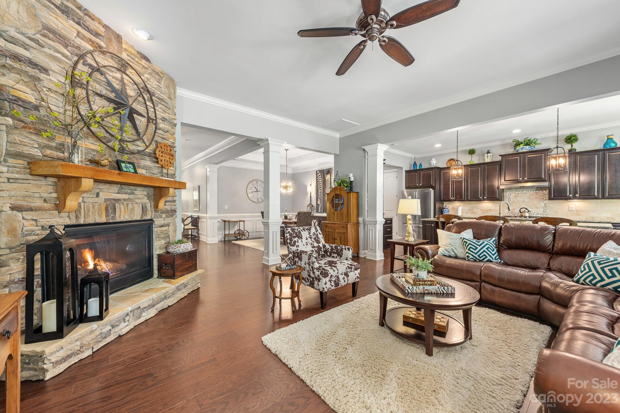 9006 Blue Ridge Drive Indian Land, SC 29707 - Photo 7 of 27 a living room with furniture and a fireplace