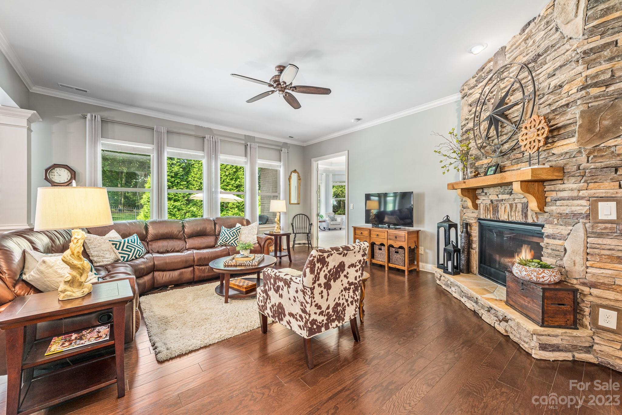 9006 Blue Ridge Drive Indian Land, SC 29707 - Photo 8 of 27 a living room with fireplace furniture and a large window