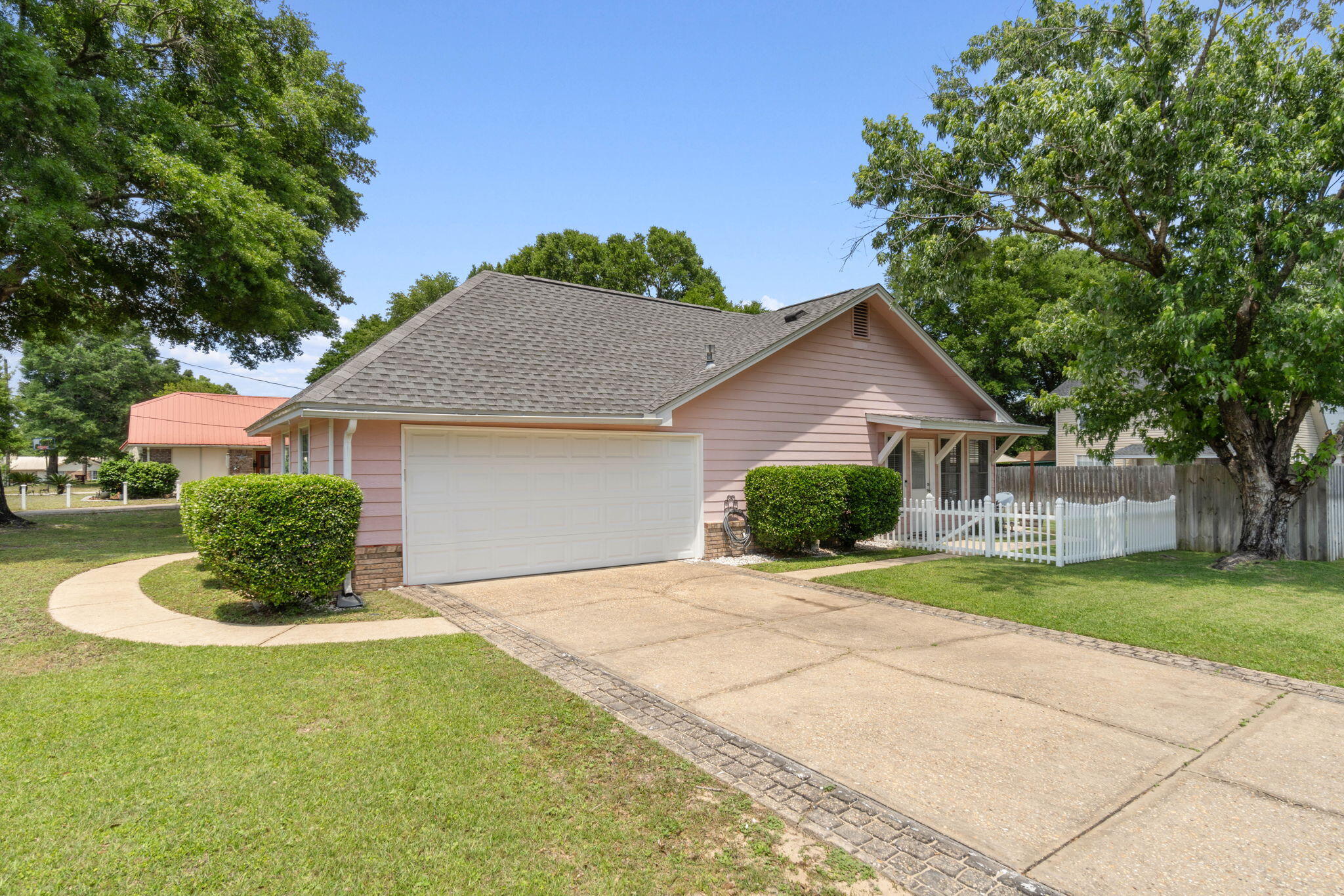 40 Abbey Road Crestview, FL 32539 - Photo 5 of 37 a front view of a house with a yard and garage