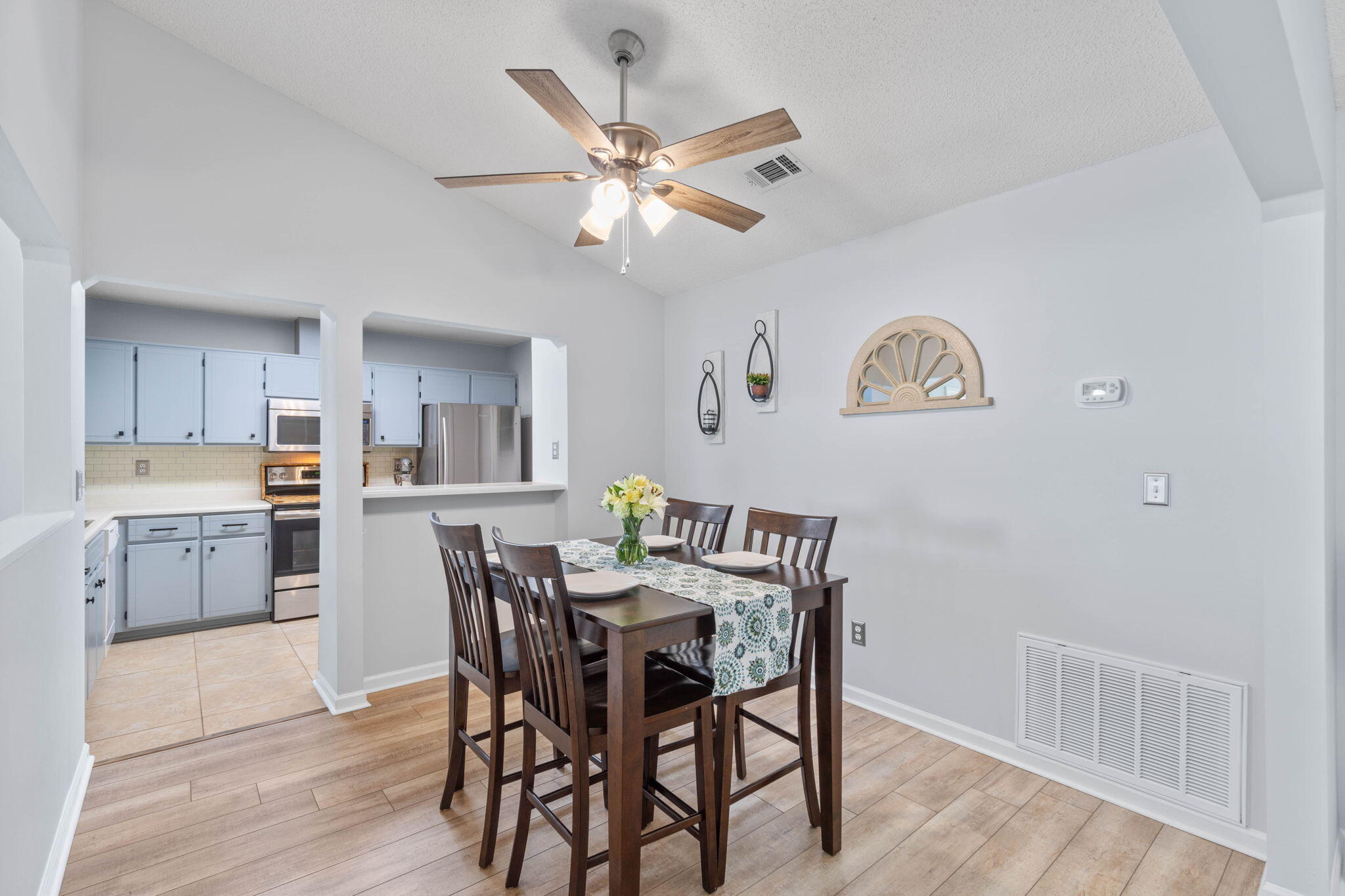 40 Abbey Road Crestview, FL 32539 - Photo 8 of 37 a view of a dining room with furniture and wooden floor