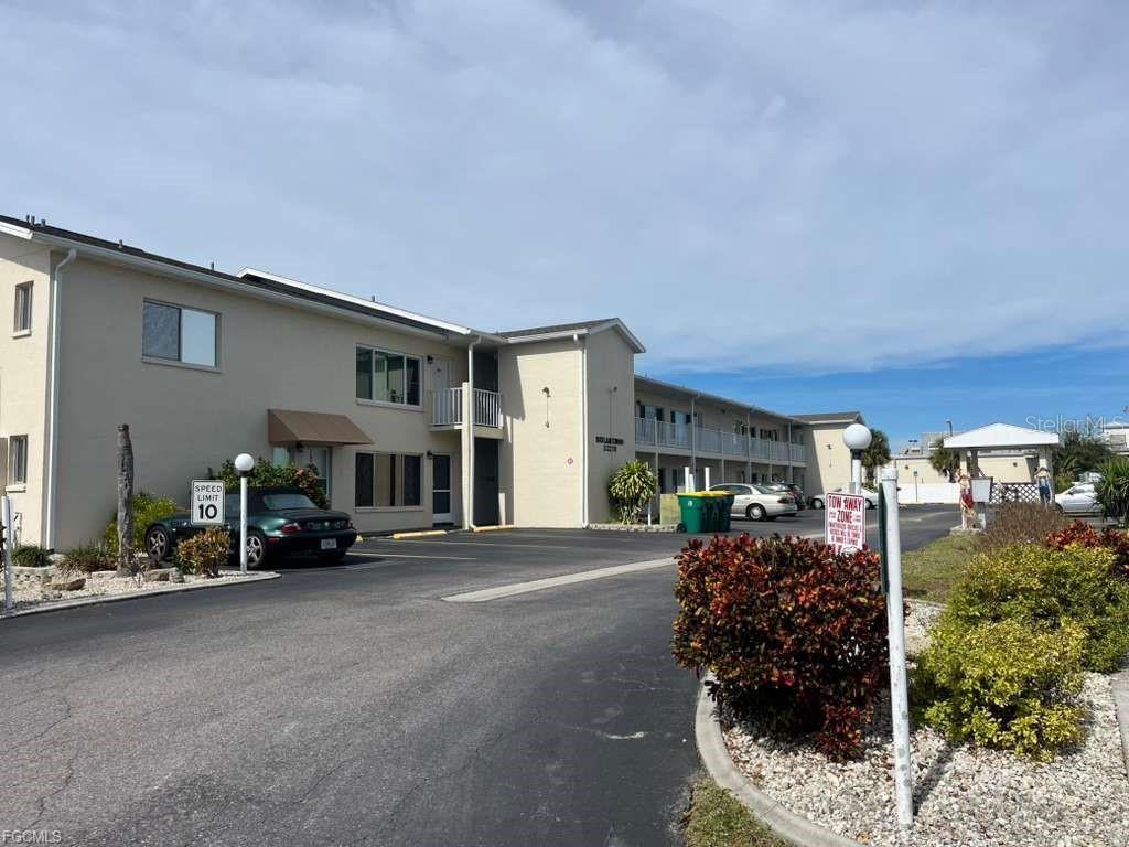 a view of a car park in front of house