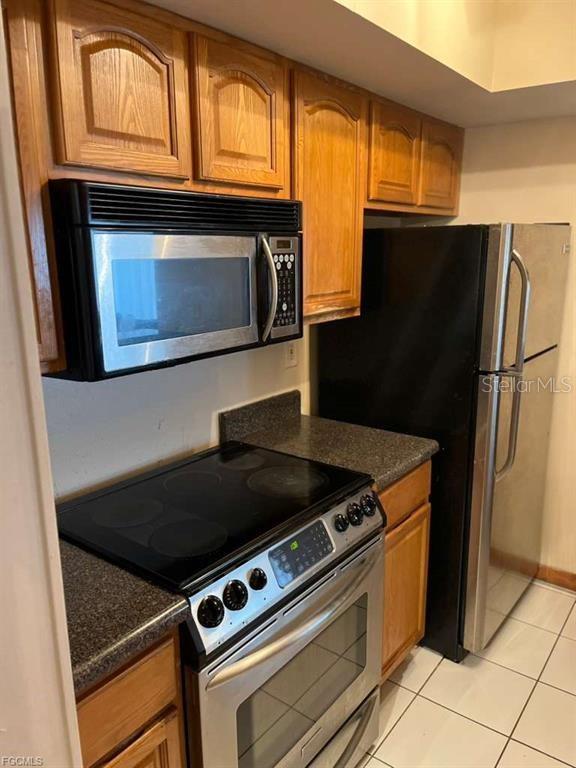 22278 Vick Street, Unit A112 Punta Gorda, FL 33980 - Photo 15 of 33 a kitchen with granite countertop cabinets and steel stainless steel appliances and cabinets