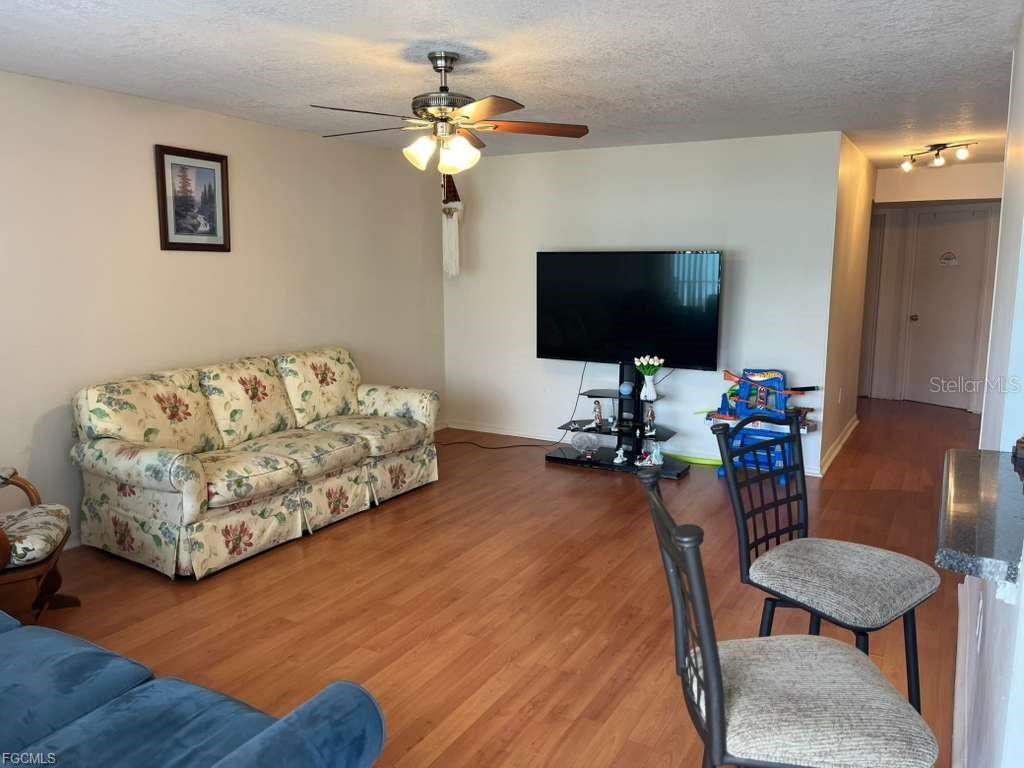 22278 Vick Street, Unit A112 Punta Gorda, FL 33980 - Photo 17 of 33 a living room with furniture and a flat screen tv
