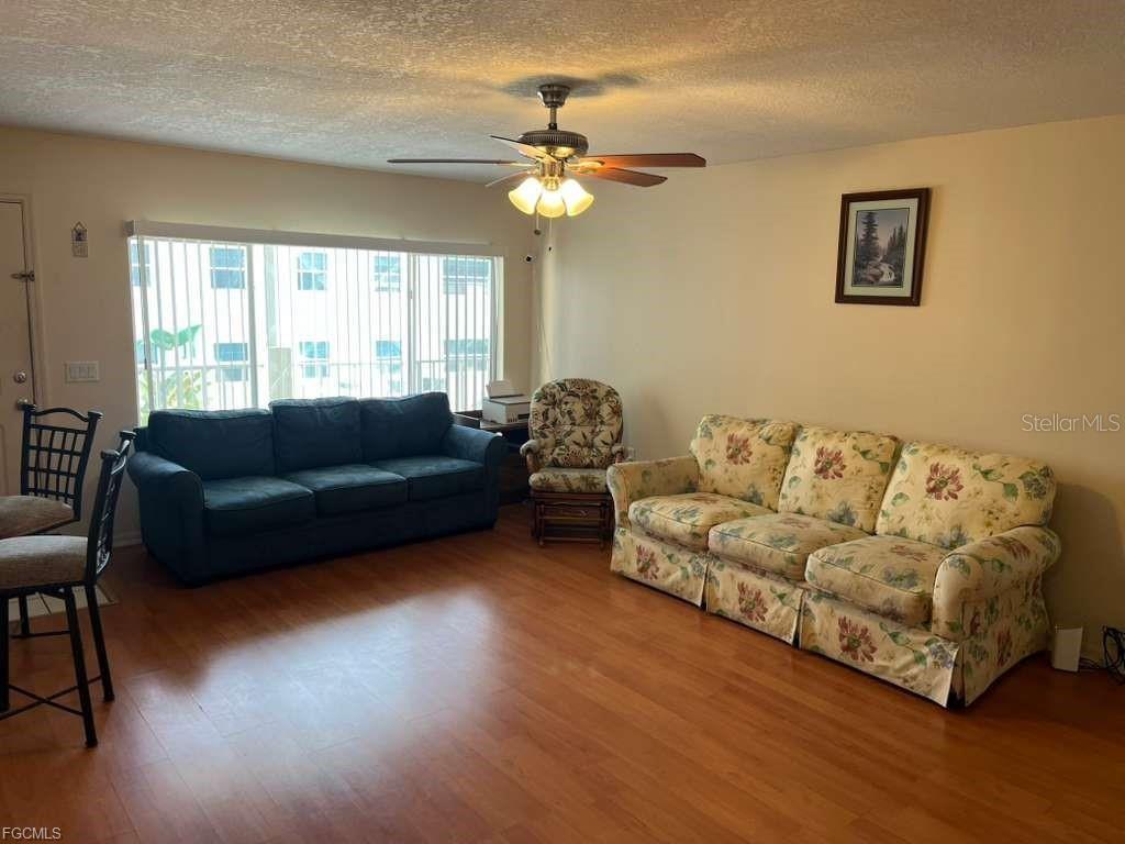 22278 Vick Street, Unit A112 Punta Gorda, FL 33980 - Photo 18 of 33 a living room with furniture and a large window