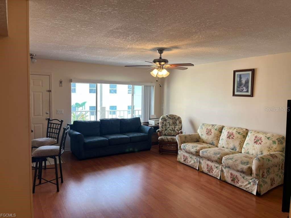 22278 Vick Street, Unit A112 Punta Gorda, FL 33980 - Photo 22 of 33 a living room with furniture and a large window